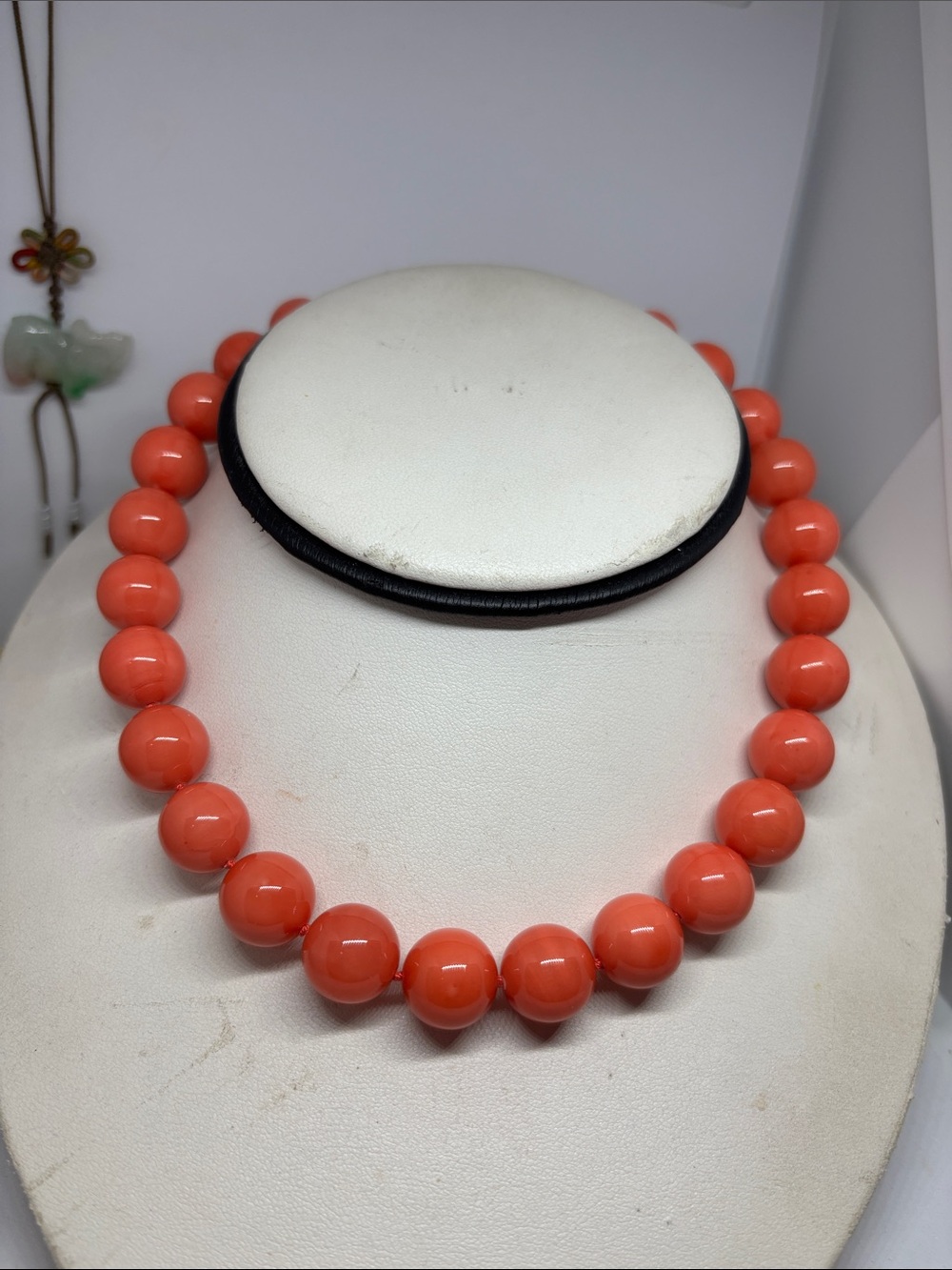 14mm coral color mother of pearl necklace. Sterling silver CZ clasp. 17”